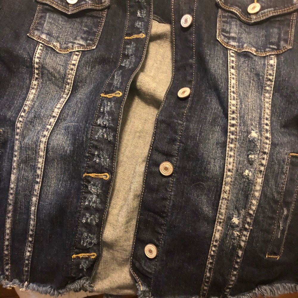 Dark washed denim with frayed edges